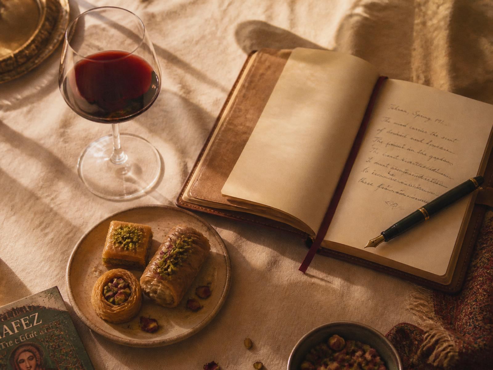 Persian pastries, wine, and a handwritten journal